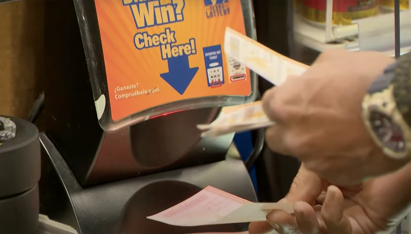 Texas lottery player checking their tickets at a local retailer.