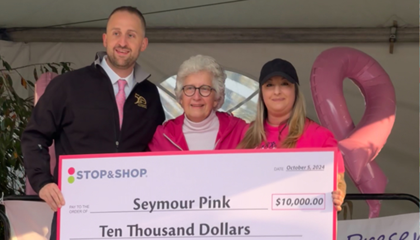 Rob Kelly from the CT Lottery, Mary Deming from Seymour Pink, and Rachel Enama from Stop & Shop holding the $10,000 commemorative check.