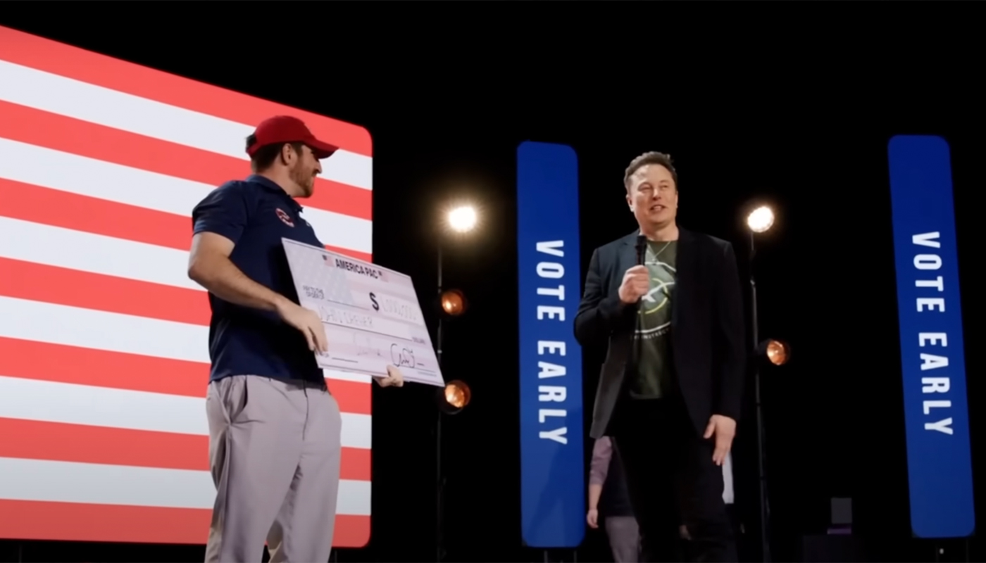 Elon Musk awarding a $1 Million check to one of his sweepstake's winner.