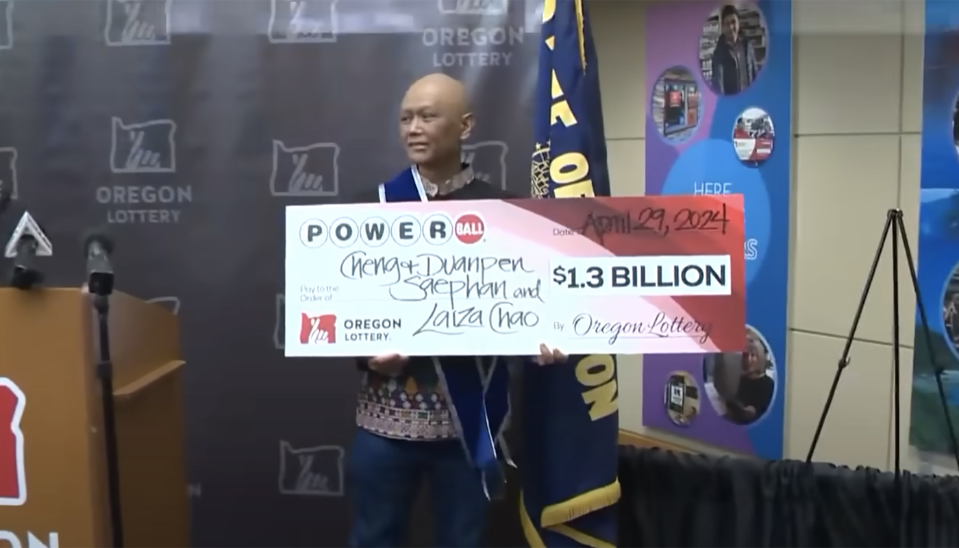 Cheng Saephan, who was battling cancer, receiving his $1.3 billion Powerball check from the Oregon Lottery.