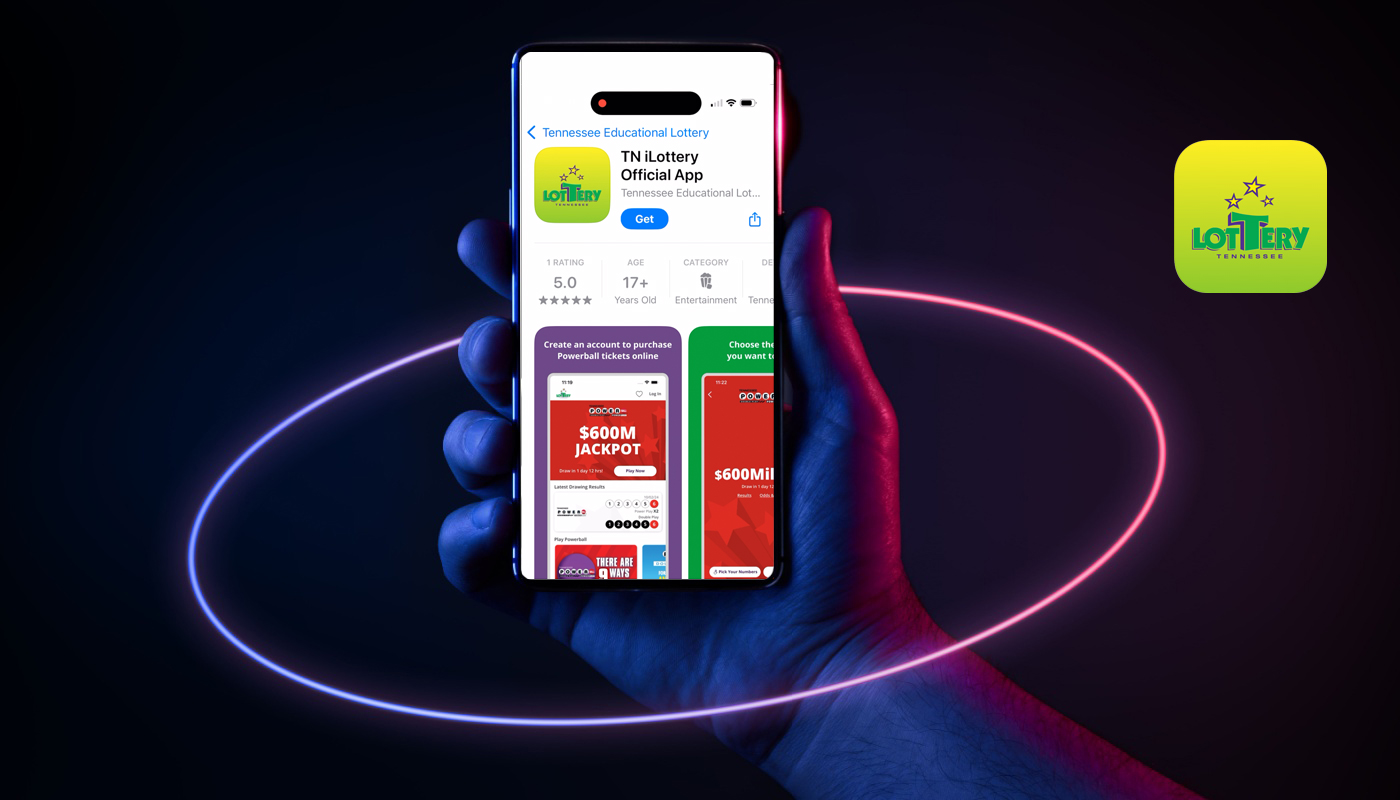 A hand holding a mobile phone that shows the app store page for the new Tennessee Lottery app that allows players to buy Powerball tickets.