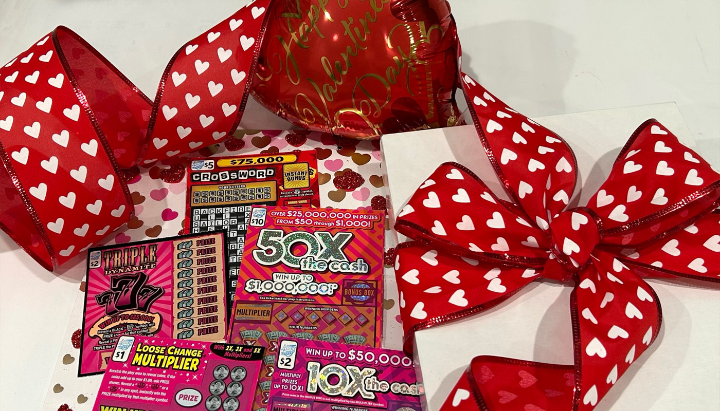 A mix of Illinois Lottery scratch-off tickets and Valentine Day's themed decorations.