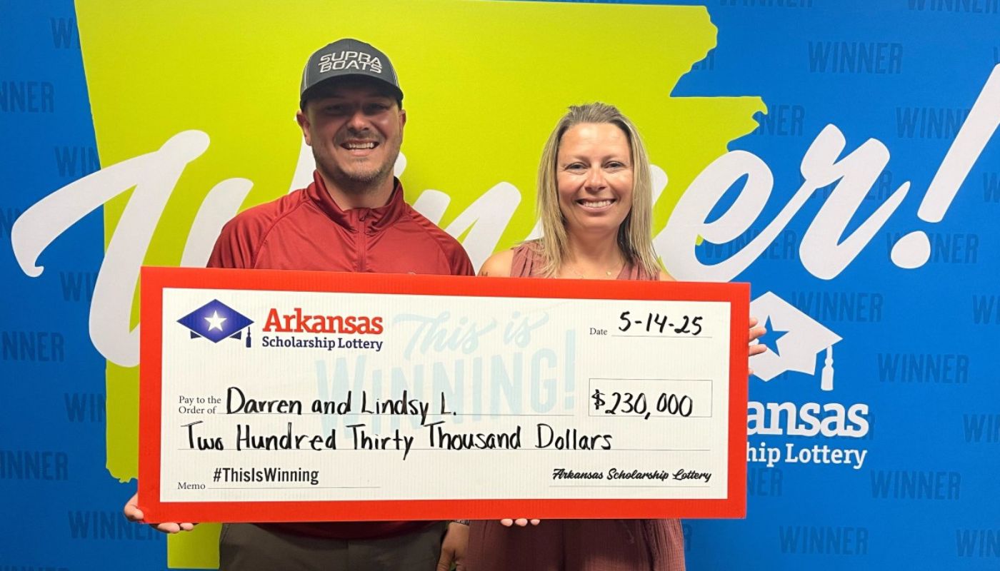 Darren and Lindsy L. with their $230,000 check from the Arkansas Lottery.