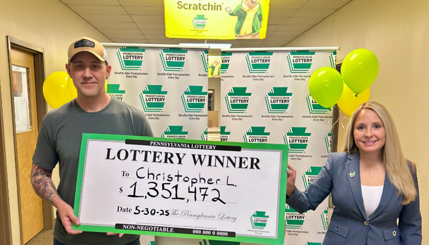 Christopher Lehman received his $1,351,472 check from the Pennsylvania Lottery.