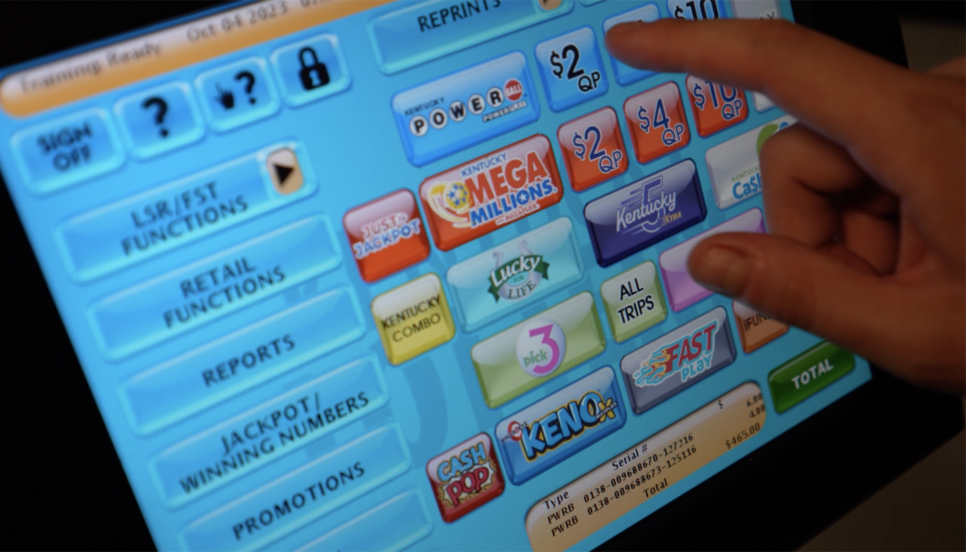 A lottery retailer using a Kentucky Lottery terminal.