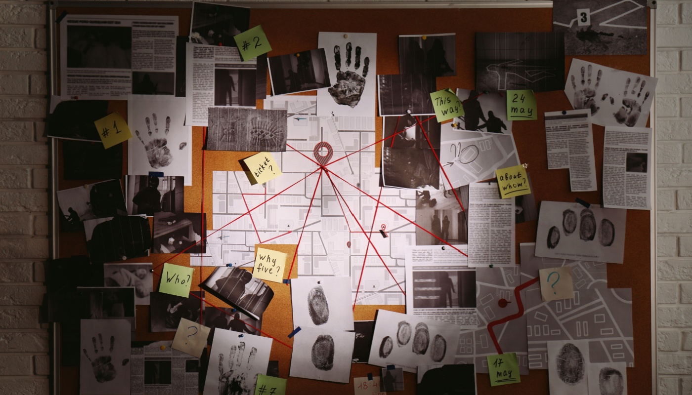 A detective's billboard with notes and annotations about a case.