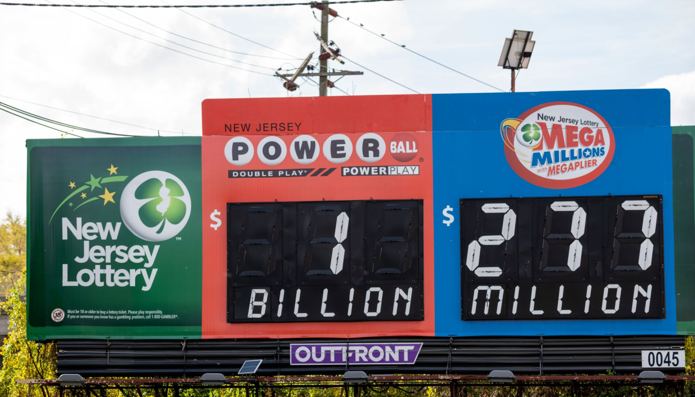 A  New Jersey Lottery billboard displaying a $1 billion Powerball jackpot, and a $277 Mega Millions jackpot.