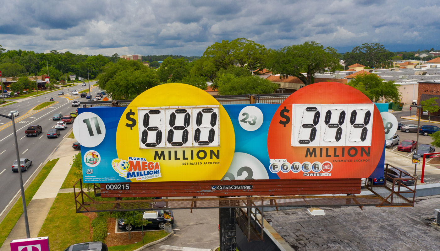 A billboard displaying a $680 million jackpot for Mega Millions and a $344 million jackpot for Powerball.