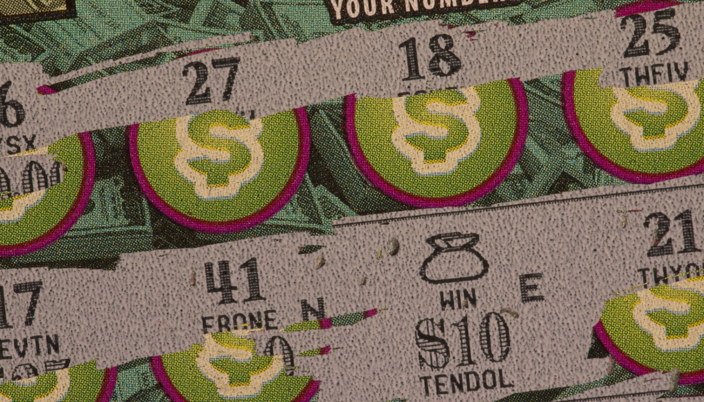 A close-up of a scratch-off ticket that has been scratched.