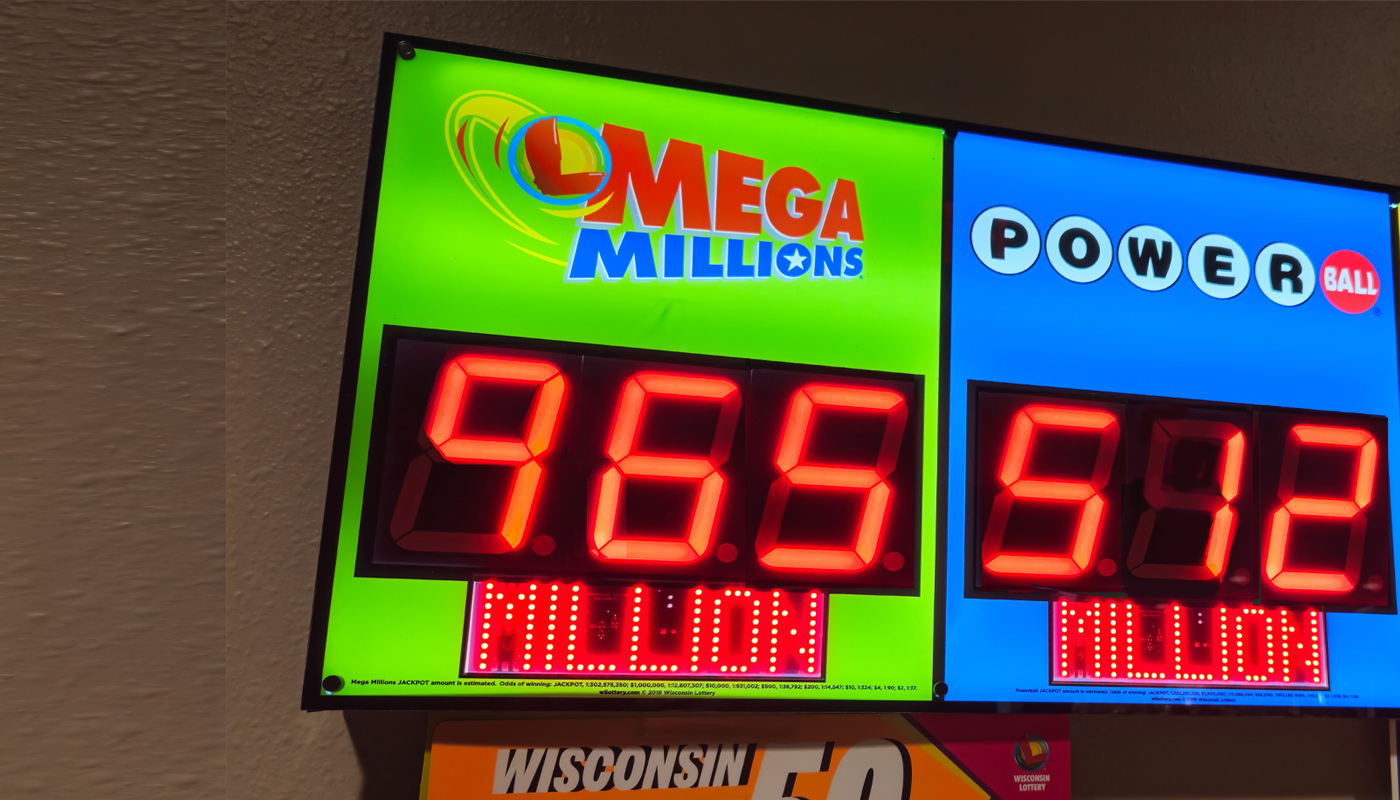 An electronic display at a lottery retailer displaying a $965 million Mega Millions jackpot.