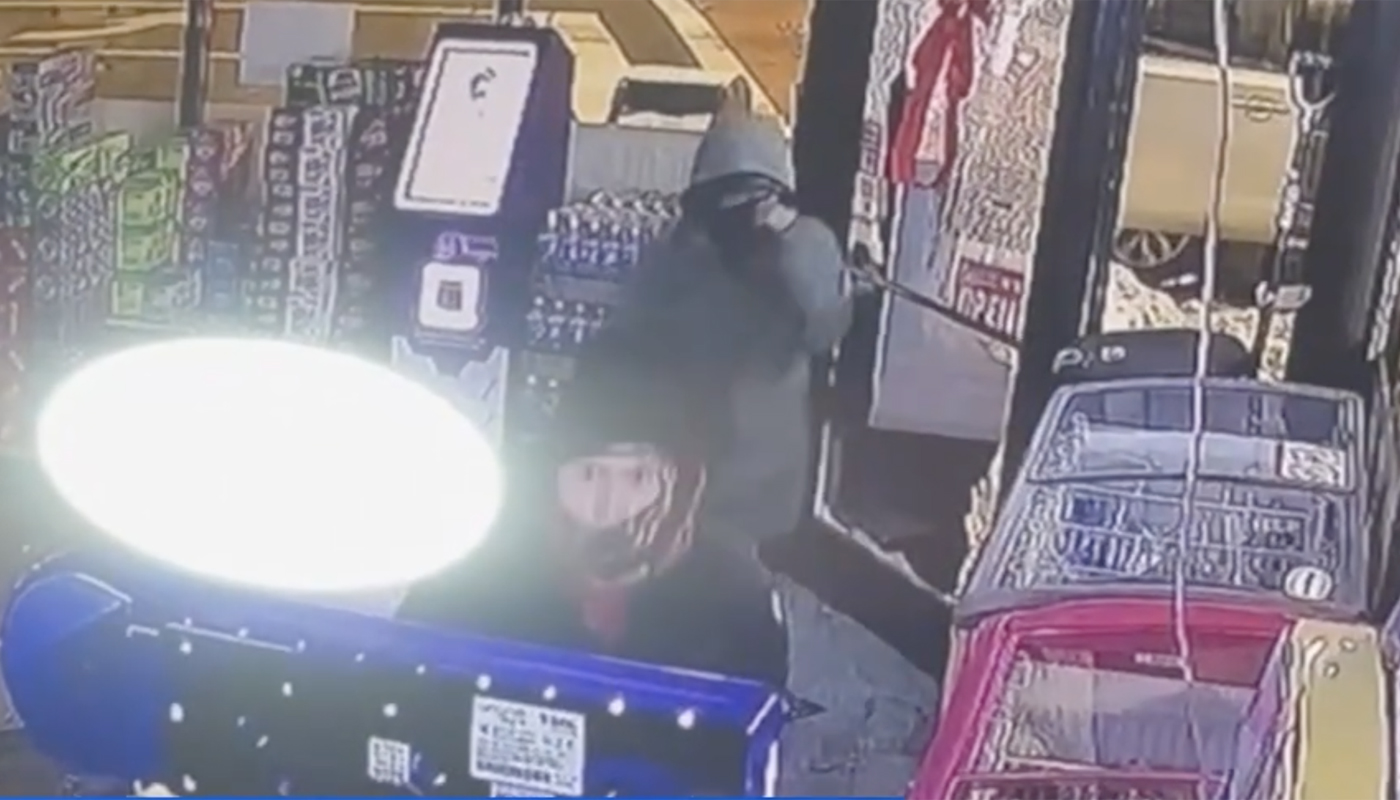 A screen capture from the security footage that shows the smash-and-grab burglary at Express Food Mart in Rogers Park, Chicago, Illinois.