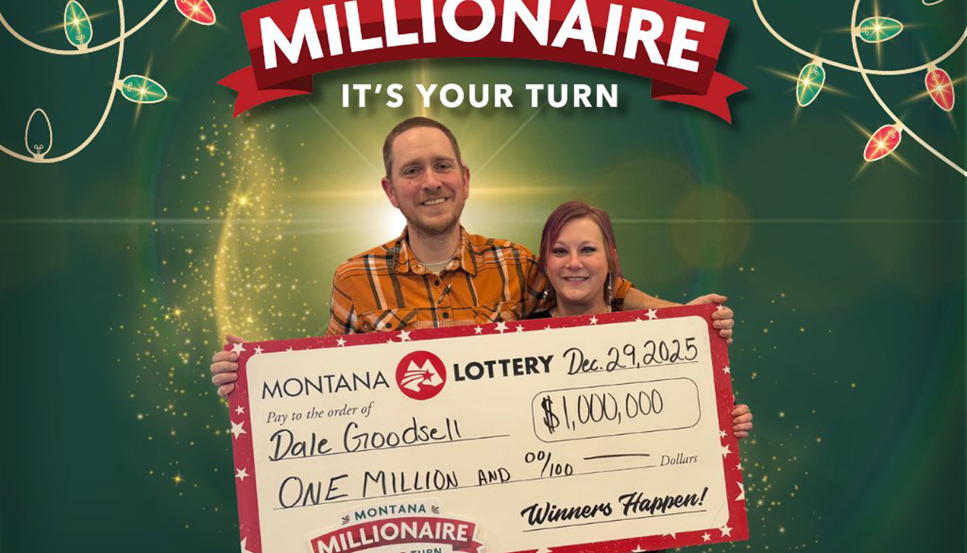Dale Goodsell holding his $1 million Montana Lottery check.