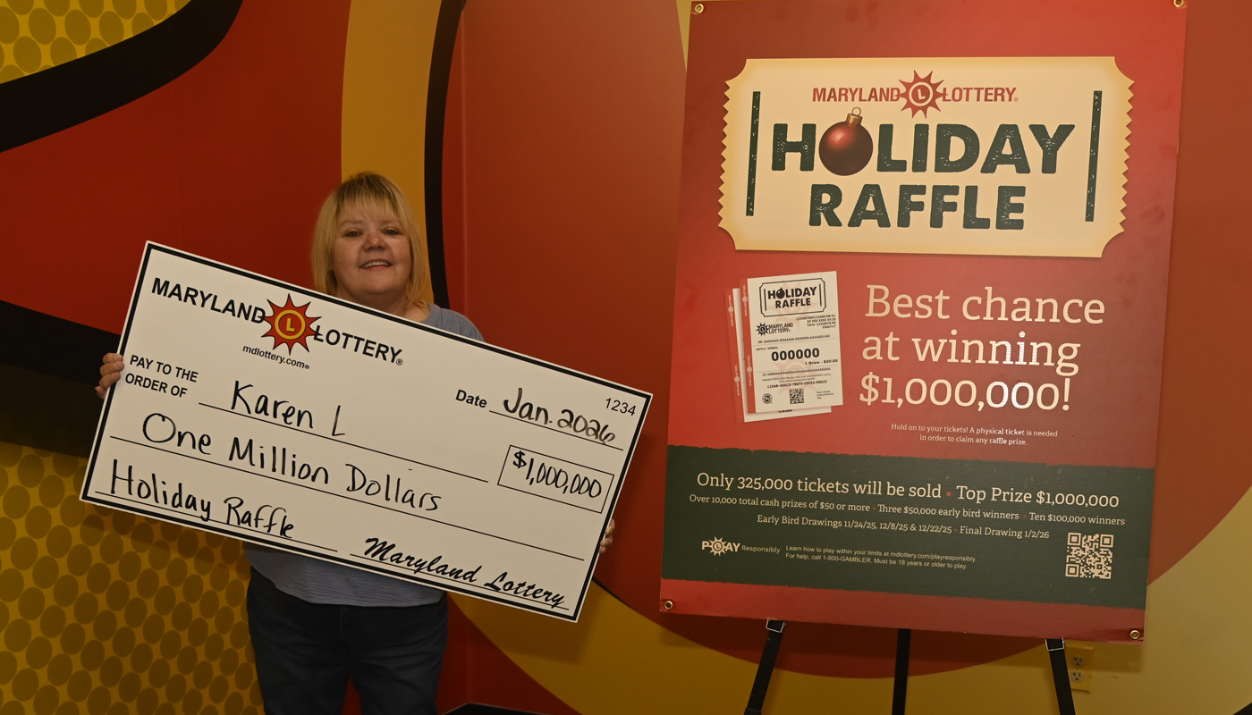 Karen L. with her $1 million Maryland Lottery Holiday Raffle check.