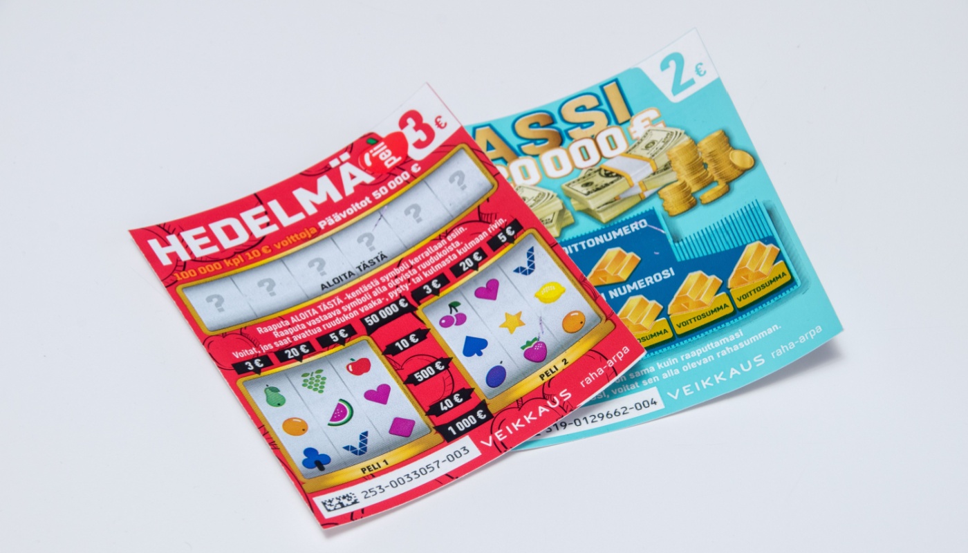 Two scratch-off cards from the Veikkaus lottery in Finland.
