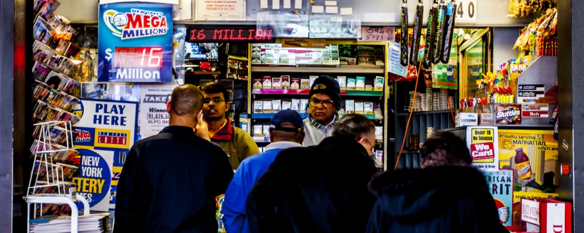 Customers lining up at a New York Lottery retailer.