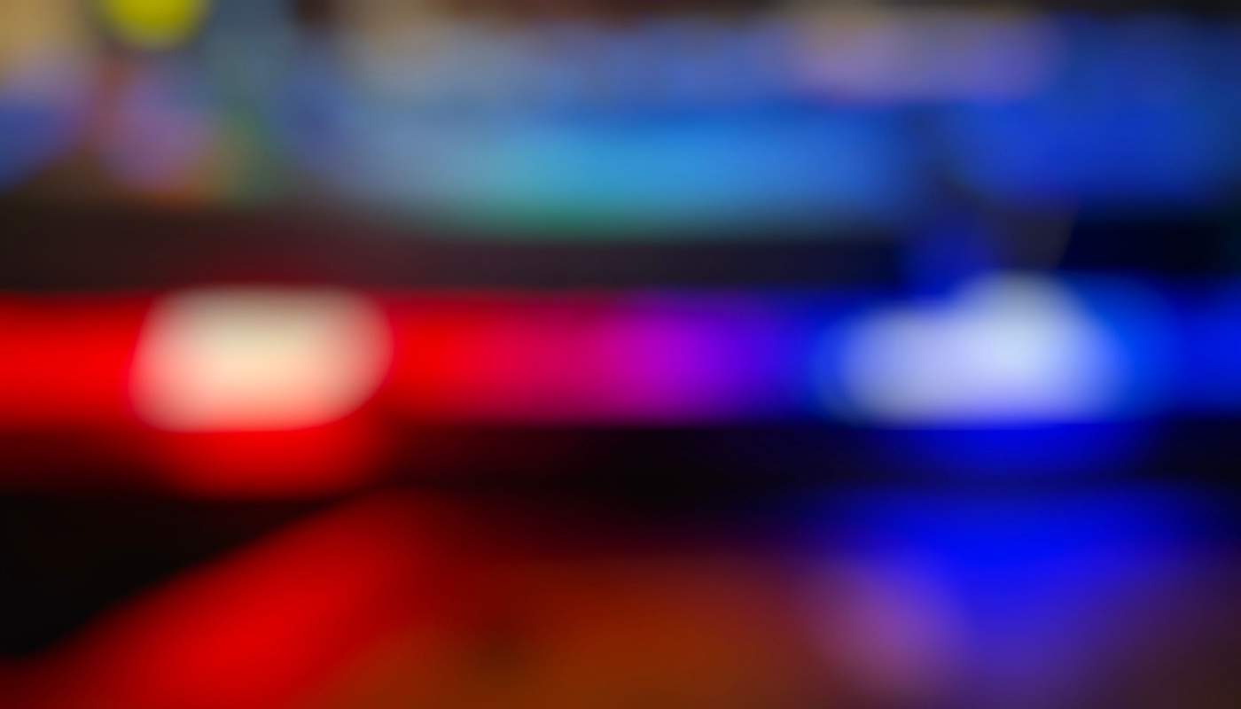 A dark background with police lights.