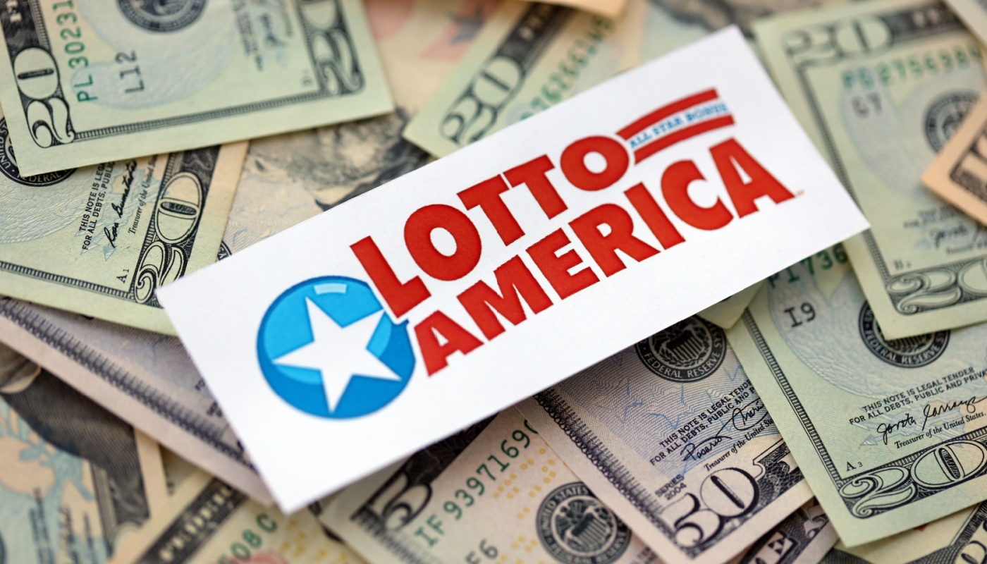 The Lotto America logo over a pile of U.S. dollars.