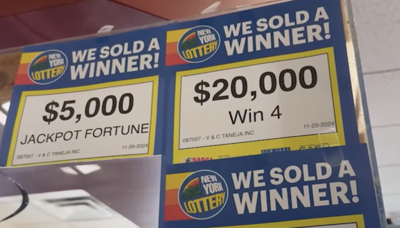 Signs with details of winning tickets sold at a local New York Lottery retailer.