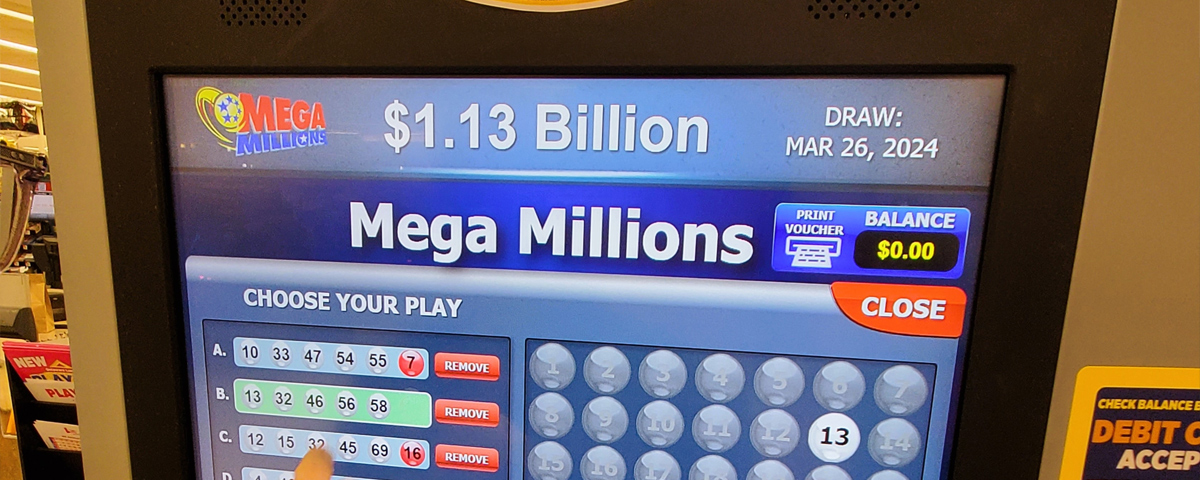 A lottery machine displaying the Mega Millions jackpot.