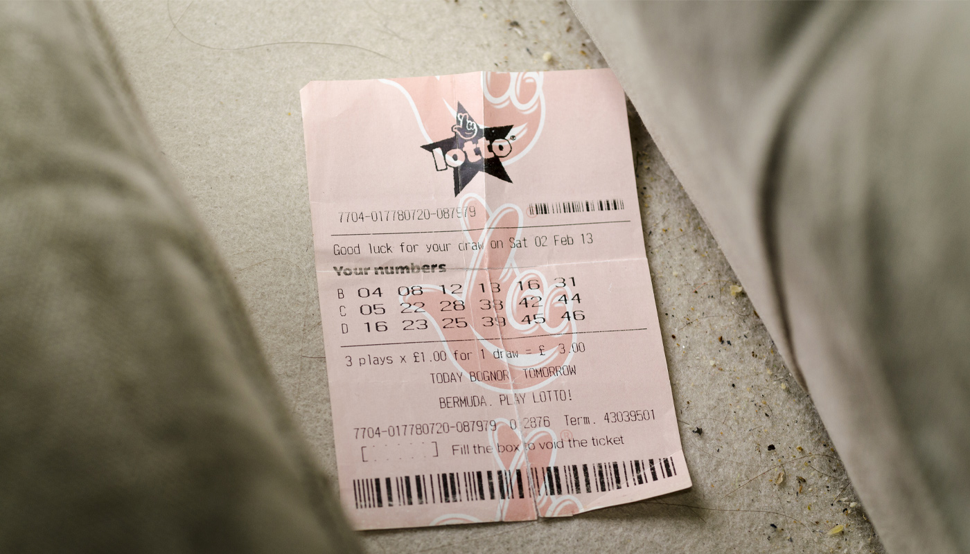 A lottery ticket, lost between two couches.