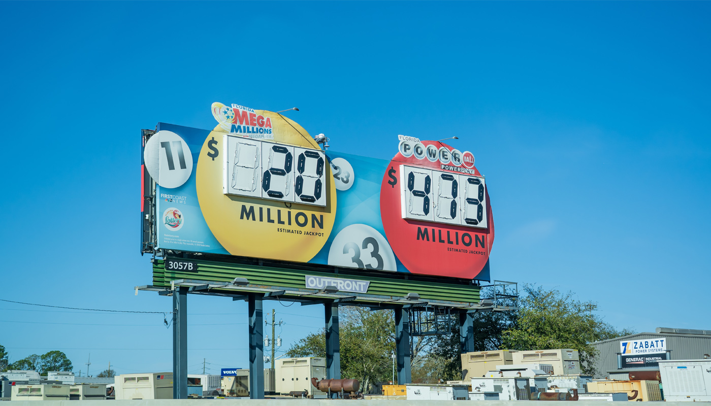 A lottery billboard displaying the Powerball and Mega Millions jackpot.