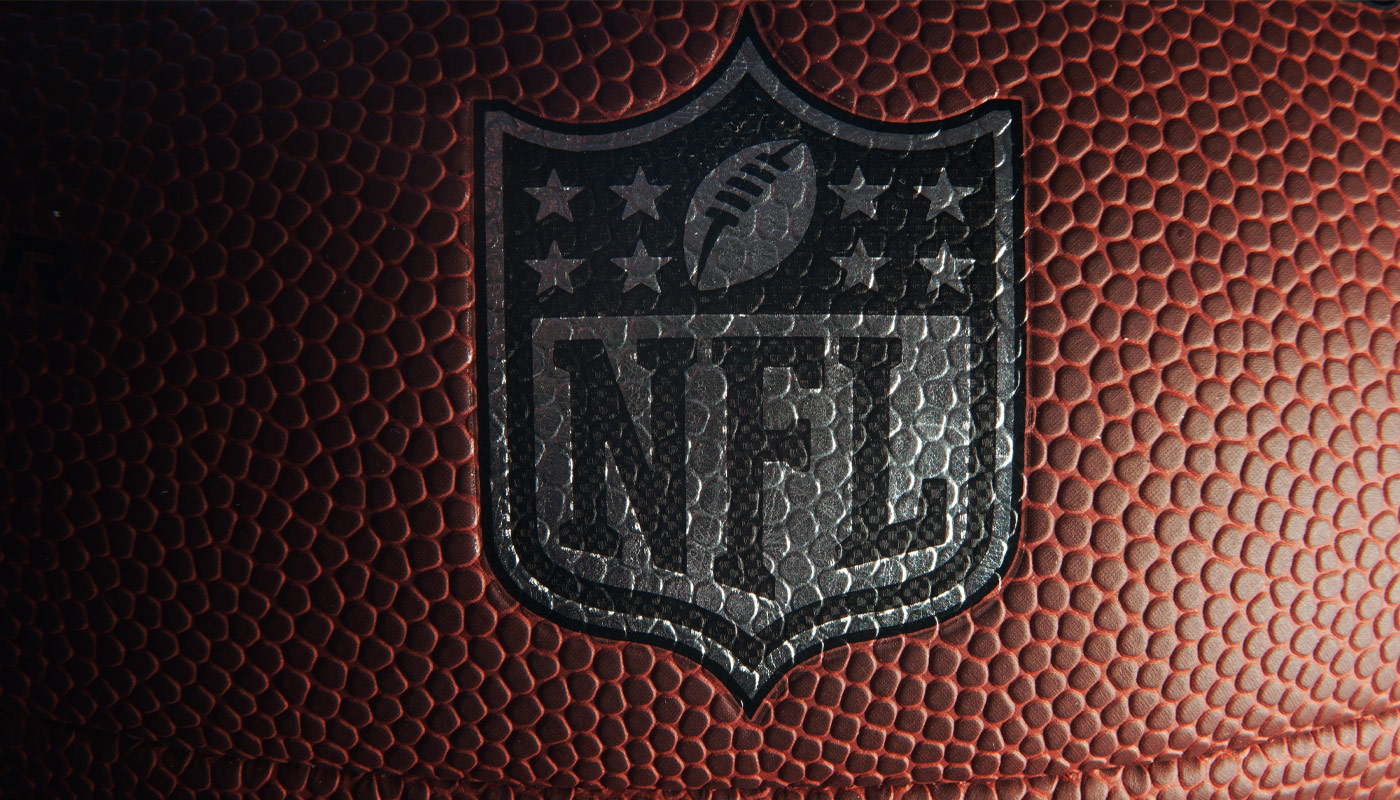 The NFL logo on a football.