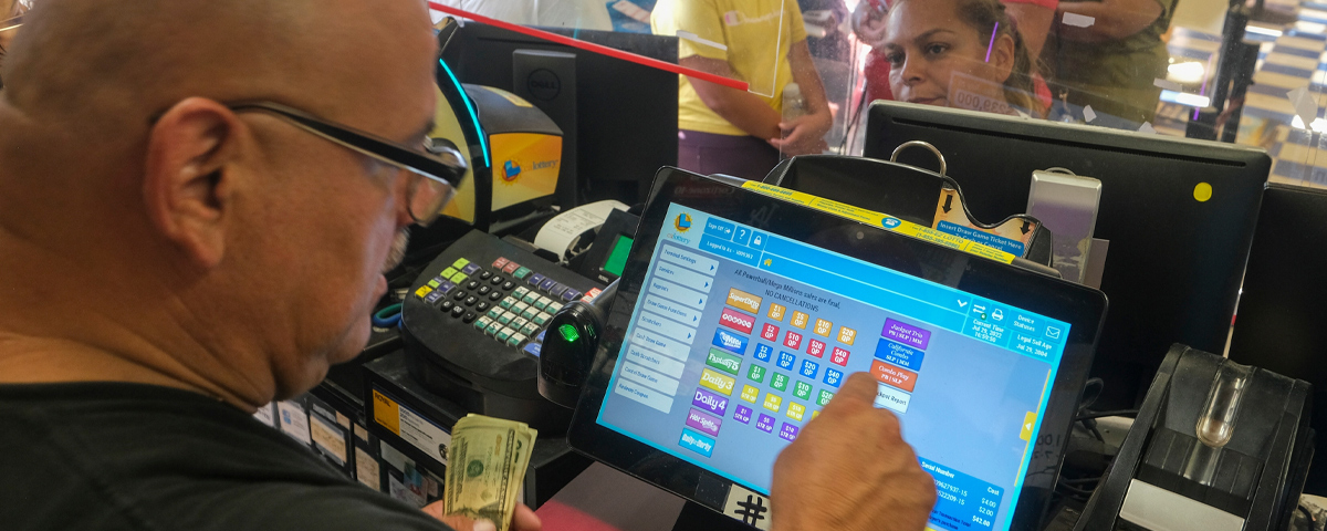 A lottery retailer selling tickets.