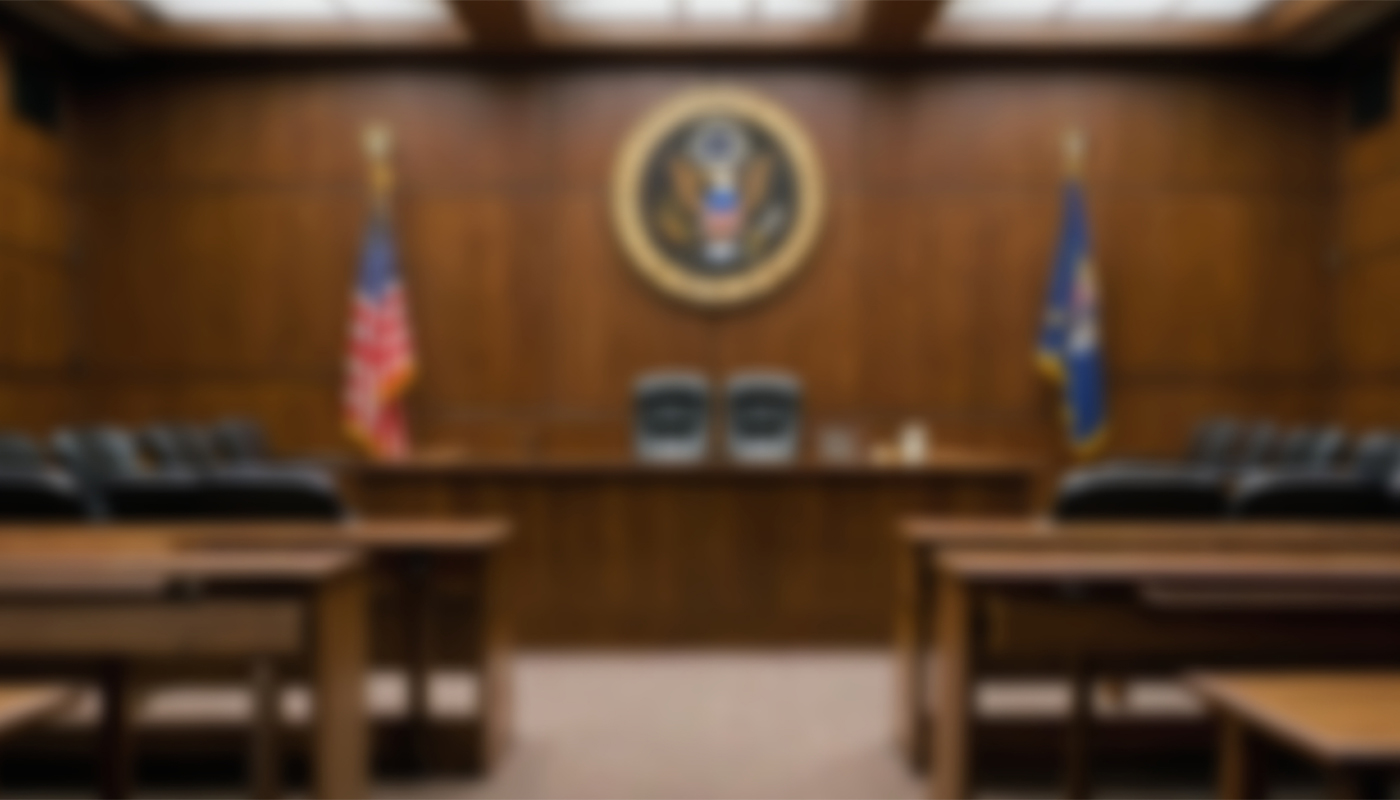 A blurry picture of a U.S. courtroom.